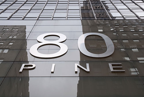 The burgeoning firm relocates from 63 Wall Street to 8o Pine Street.